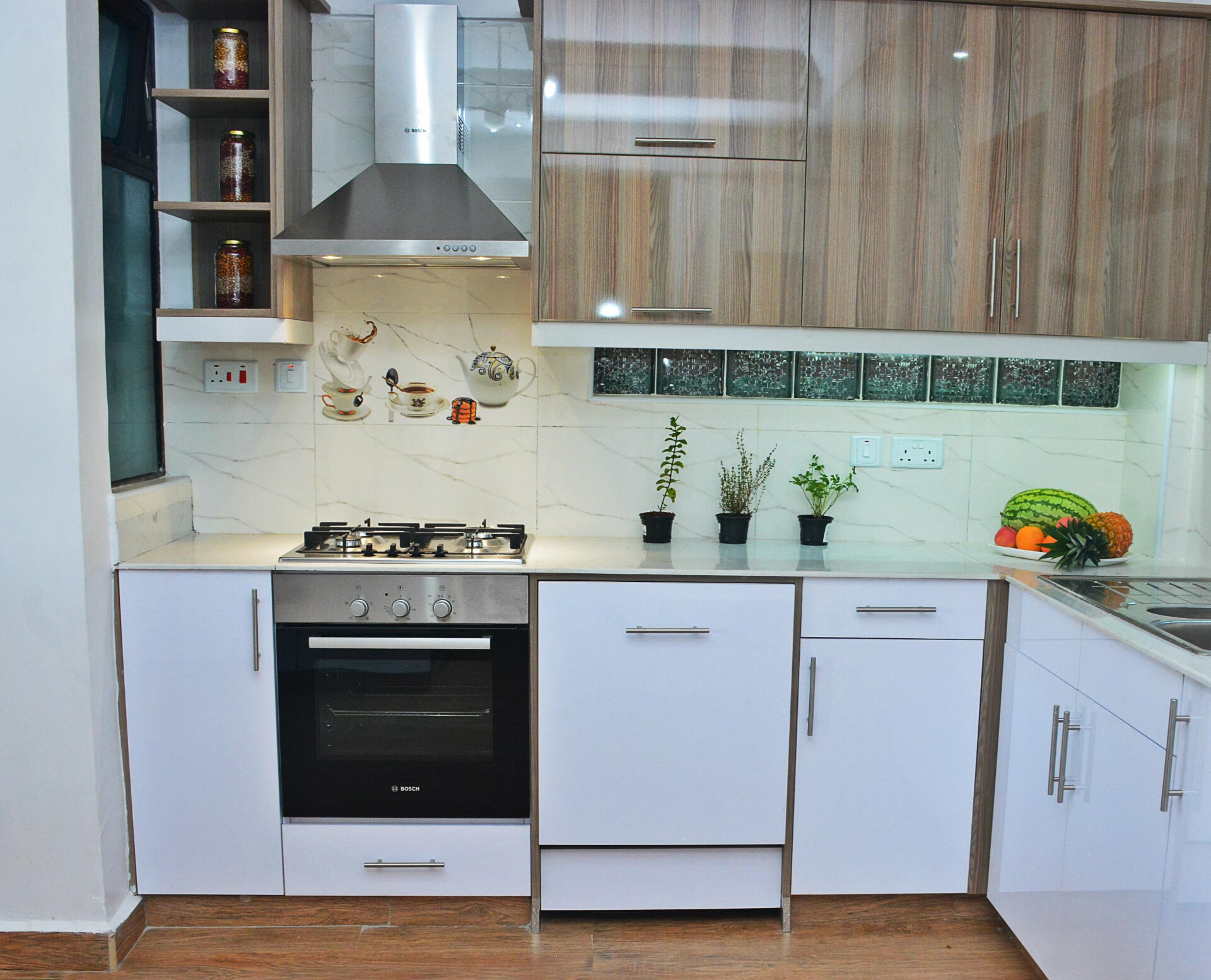 White custom cabinetry with 'local yellow' granite